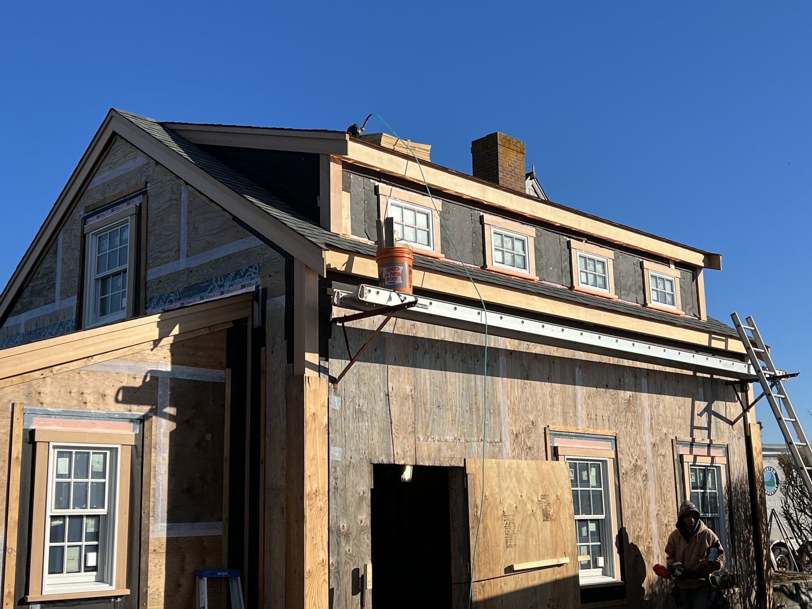 Exterior construction with new siding and window installation