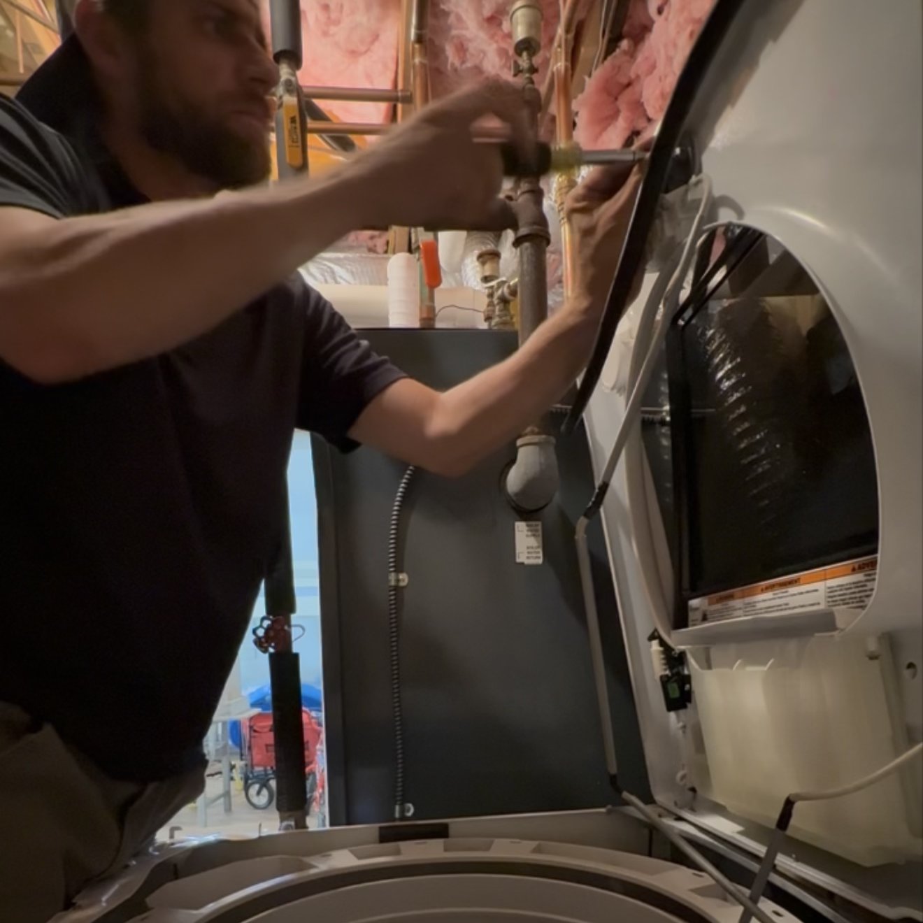Jesse Smith working on appliance repair